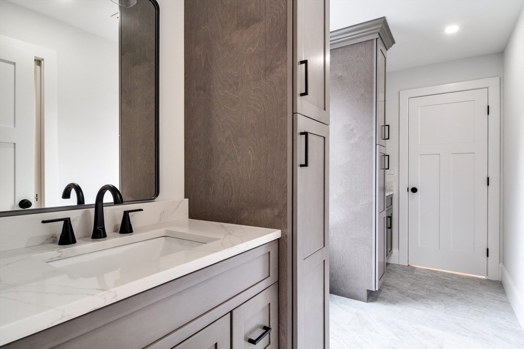75 Cottage Street Natick, MA 01760 - Photo 26 of 37 a bathroom with a sink and a mirror