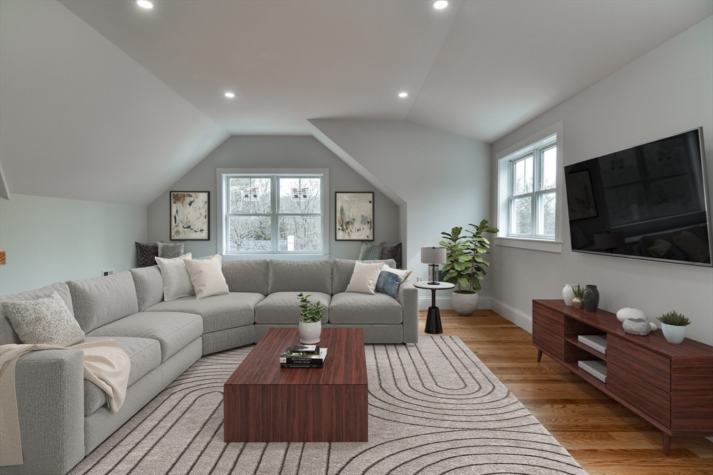 75 Cottage Street Natick, MA 01760 - Photo 31 of 37 a living room with furniture a flat screen tv and a window