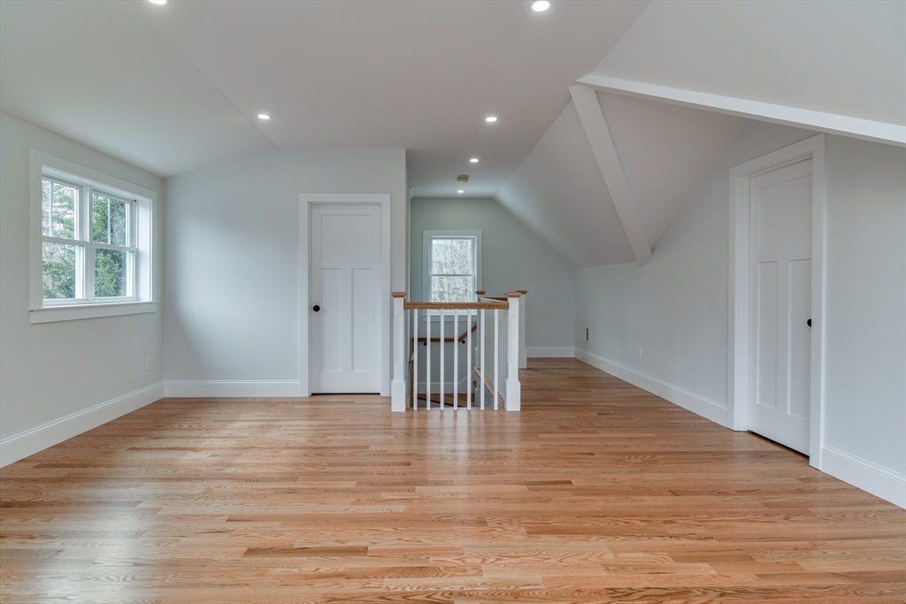 75 Cottage Street Natick, MA 01760 - Photo 33 of 37 a view of empty room with wooden floor and fan
