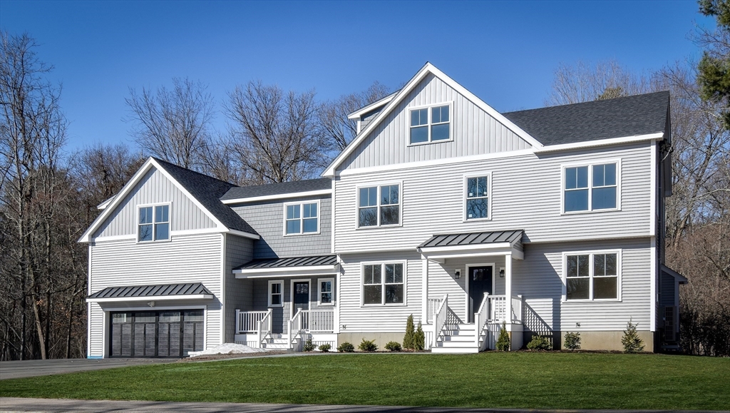 75 Cottage Street Natick, MA 01760 - Photo 36 of 37 a front view of a house with a yard