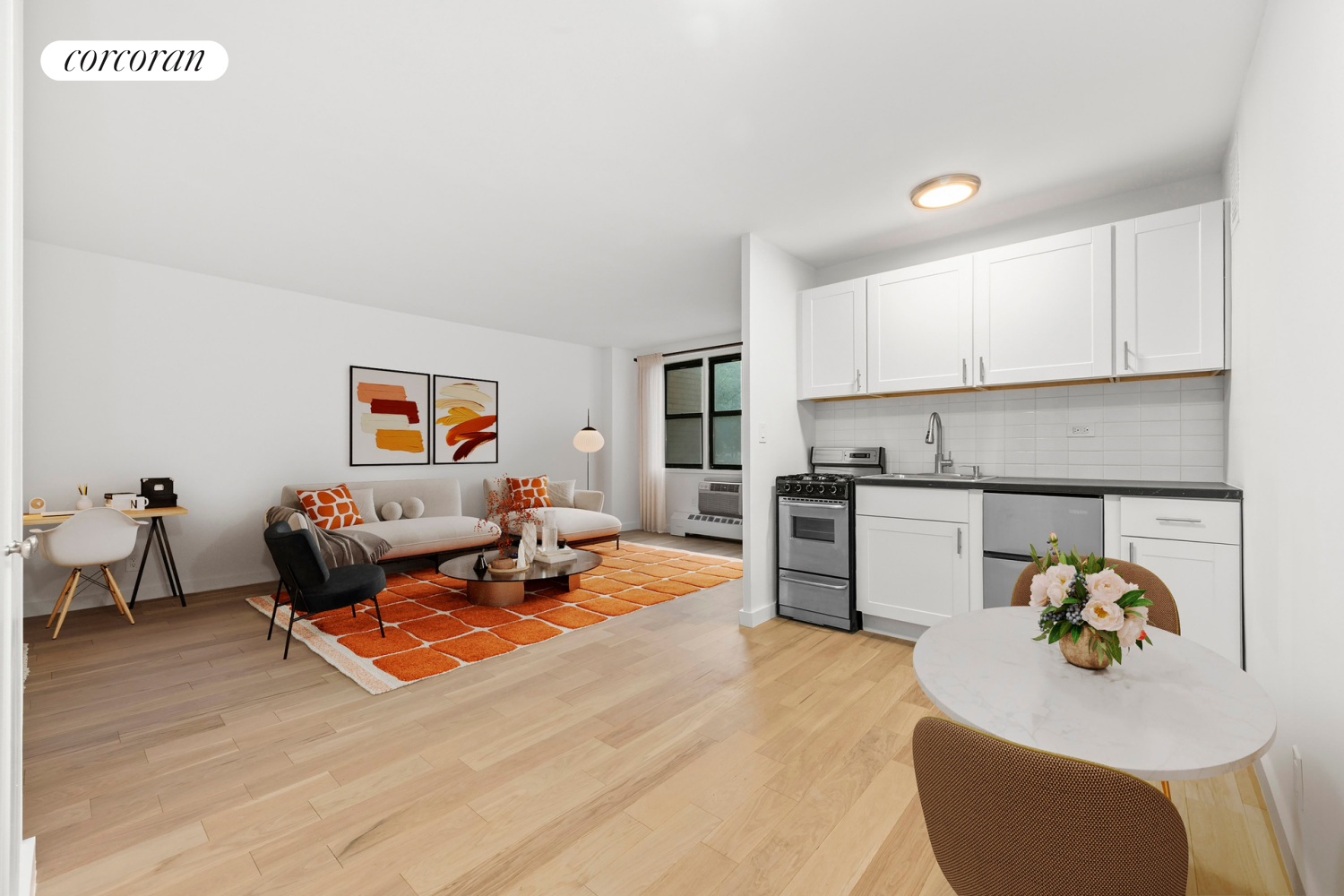 145 East 15th Street, Unit 2D Manhattan, NY 10003 - Photo 4 of 6 a living room with furniture and kitchen view
