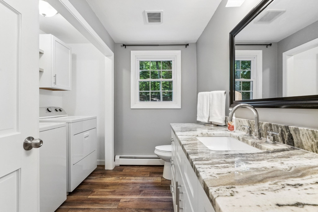 66 Dodge Road Sutton, MA 01590 - Photo 15 of 38 a bathroom with a sink a mirror and a shower