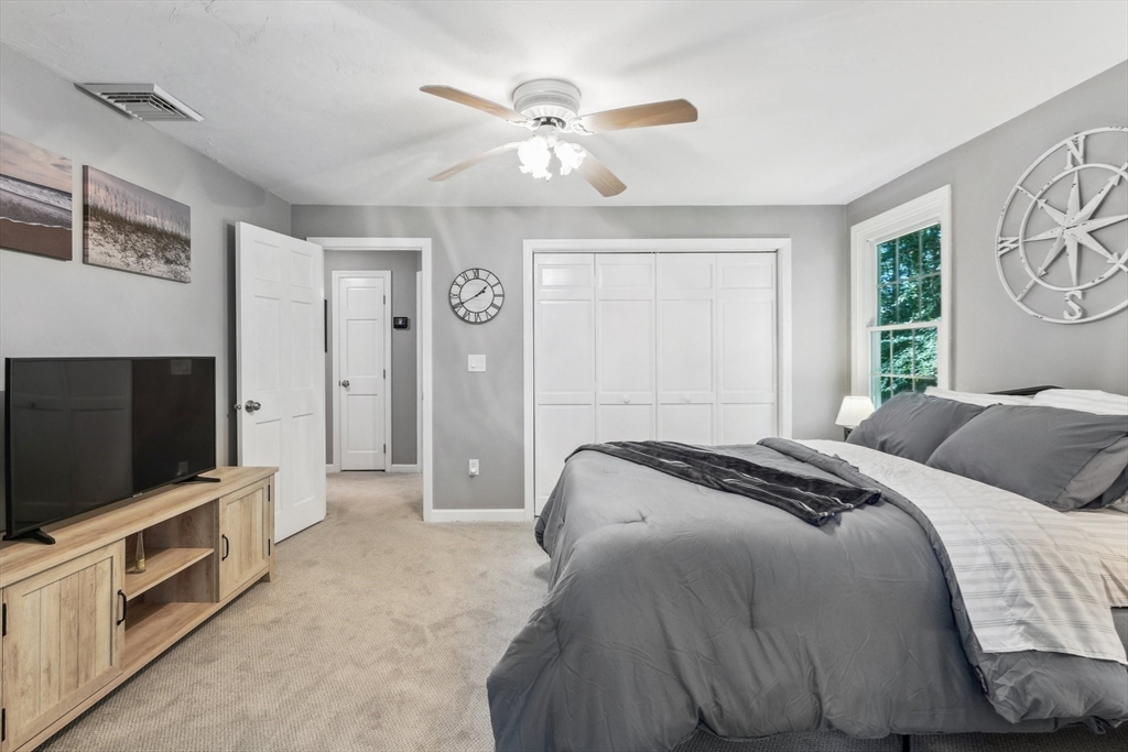 66 Dodge Road Sutton, MA 01590 - Photo 24 of 38 a bedroom with a bed and a flat screen tv