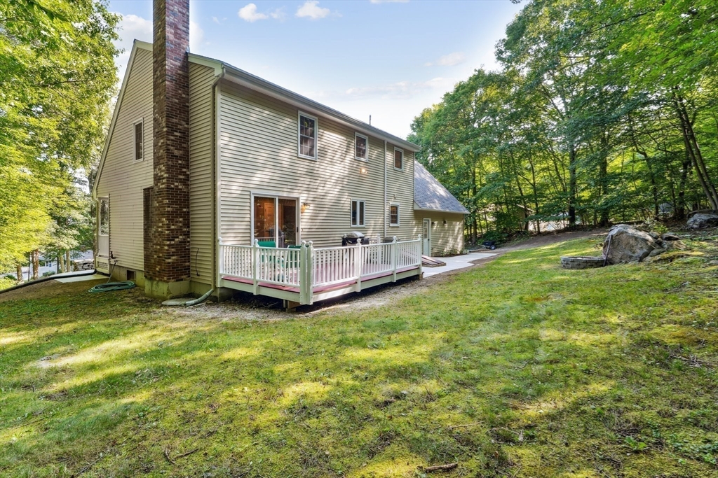 66 Dodge Road Sutton, MA 01590 - Photo 30 of 38 a view of a house with backyard and garden