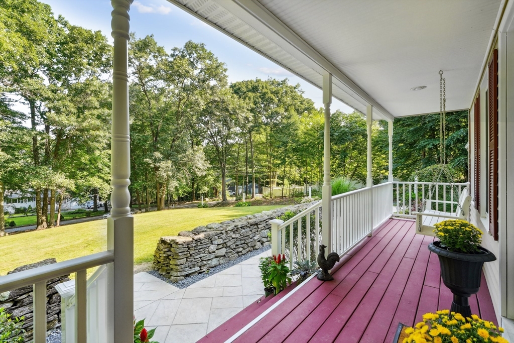 66 Dodge Road Sutton, MA 01590 - Photo 3 of 38 a view of a balcony with floor to ceiling windows wooden floor
