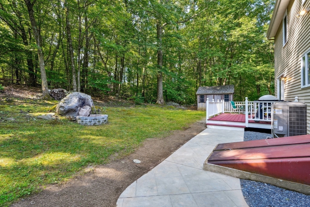 66 Dodge Road Sutton, MA 01590 - Photo 31 of 38 a front view of a house with garden