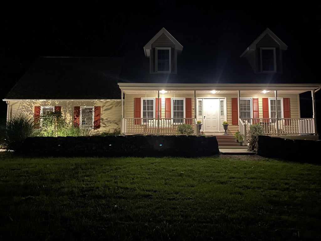 66 Dodge Road Sutton, MA 01590 - Photo 38 of 38 a front view of a house with a garden