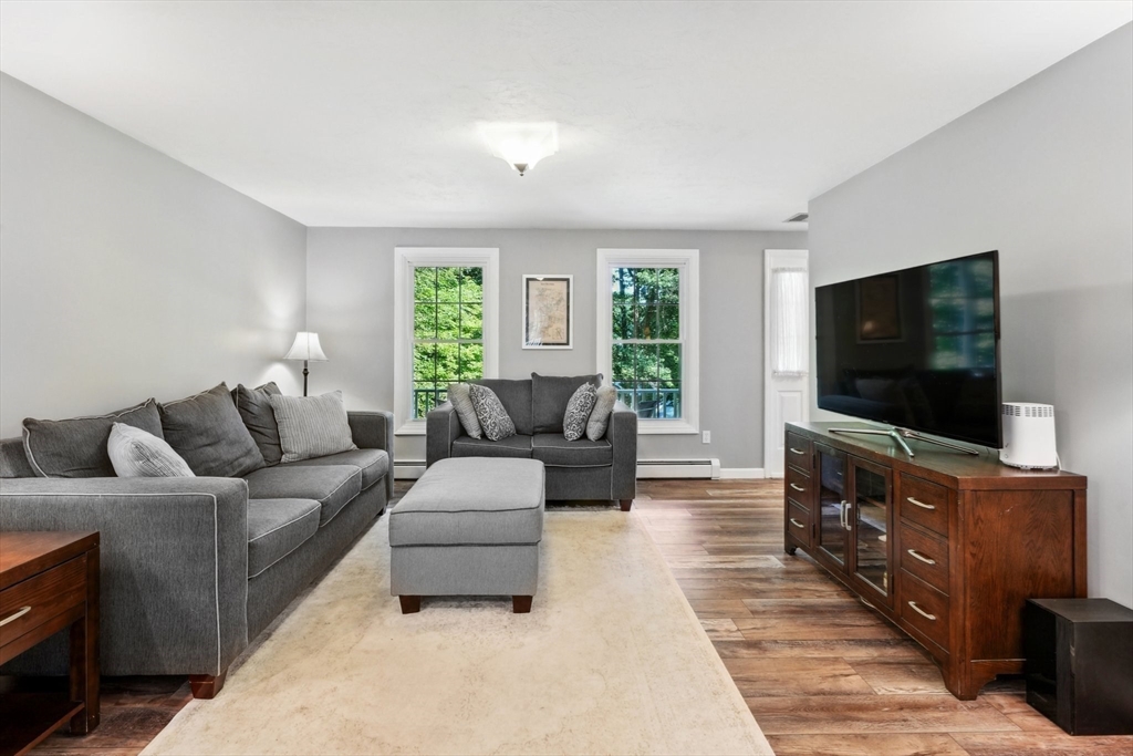 66 Dodge Road Sutton, MA 01590 - Photo 5 of 38 a living room with furniture and a flat screen tv