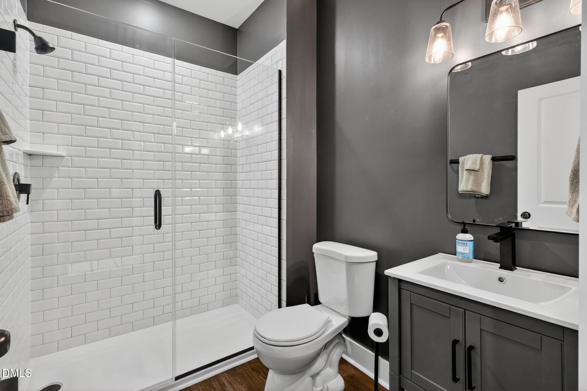 1118 Commack Drive Durham, NC 27703 - Photo 16 of 30 a bathroom with a sink toilet and shower