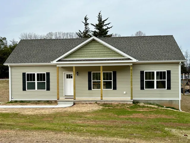 a house with swimming pool in front of it