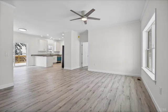 a view of a kitchen with a sink and a refrigerator