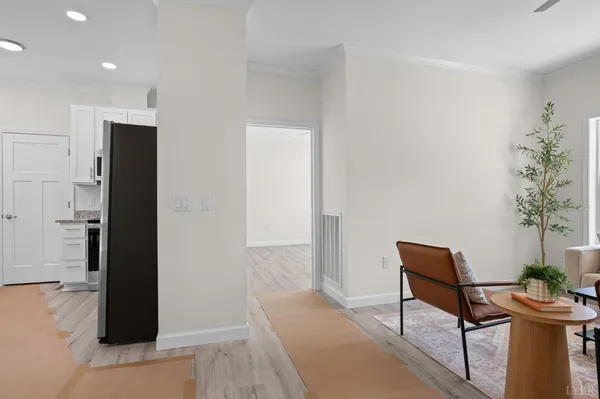 a view of a hallway with seating area