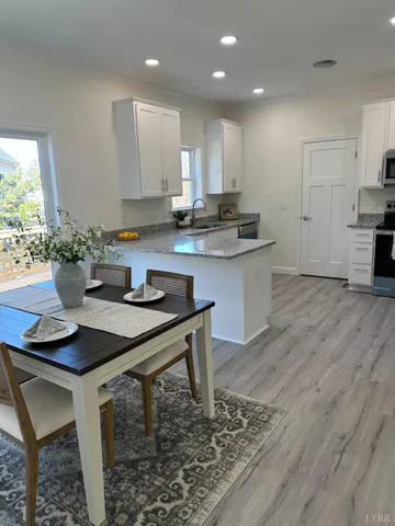 a kitchen with a table and chairs in it