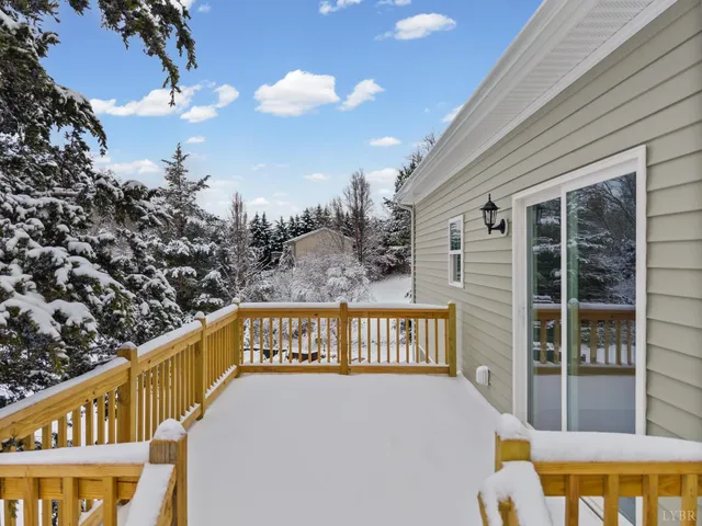 a view of a balcony with furniture