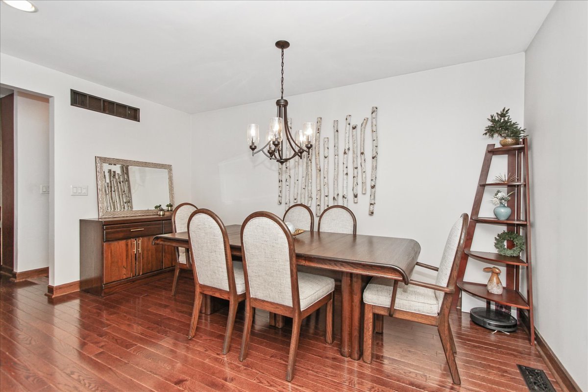 1865 Kevin Avenue Elgin, IL 60123 - Photo 15 of 48 a view of a dining room with furniture wooden floor and chandelier