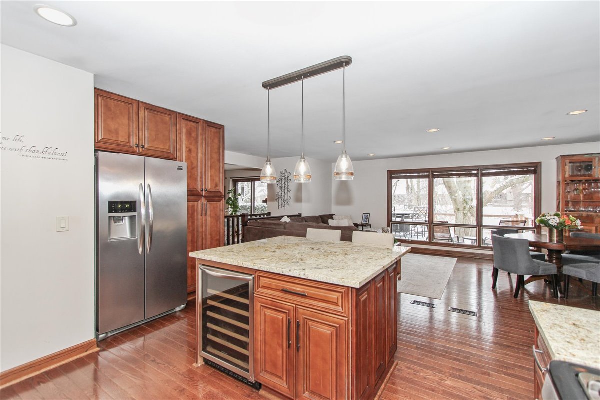 1865 Kevin Avenue Elgin, IL 60123 - Photo 17 of 48 a kitchen with a chandelier appliances and wooden floor