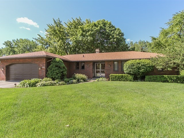 1865 Kevin Avenue Elgin, IL 60123 - Photo 2 of 48 a front view of a house with a yard