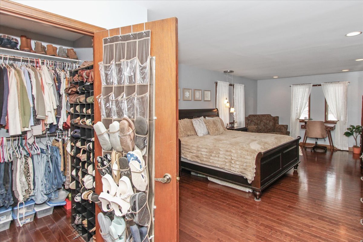 1865 Kevin Avenue Elgin, IL 60123 - Photo 25 of 48 a bedroom with a bed and a walk in closet