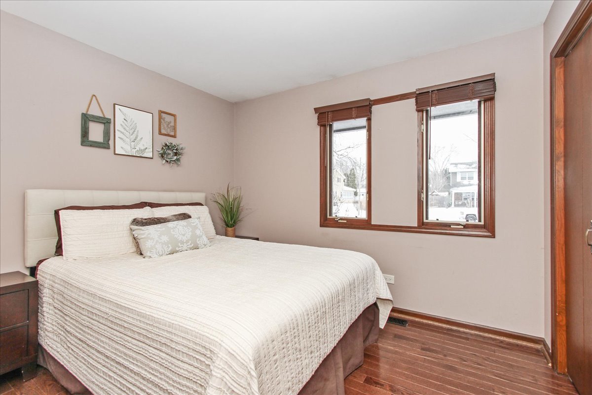 1865 Kevin Avenue Elgin, IL 60123 - Photo 28 of 48 a bedroom with a bed and a window
