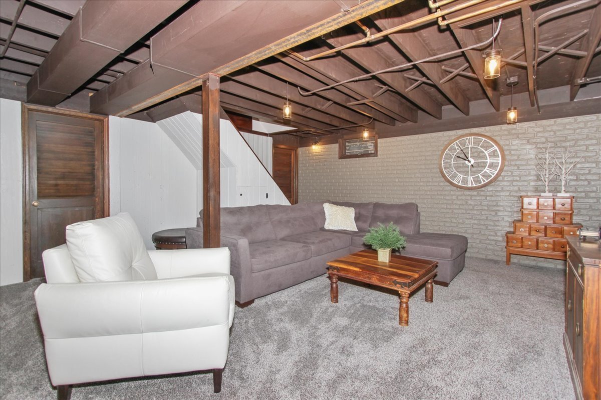 1865 Kevin Avenue Elgin, IL 60123 - Photo 30 of 48 a living room with furniture and a wooden floor