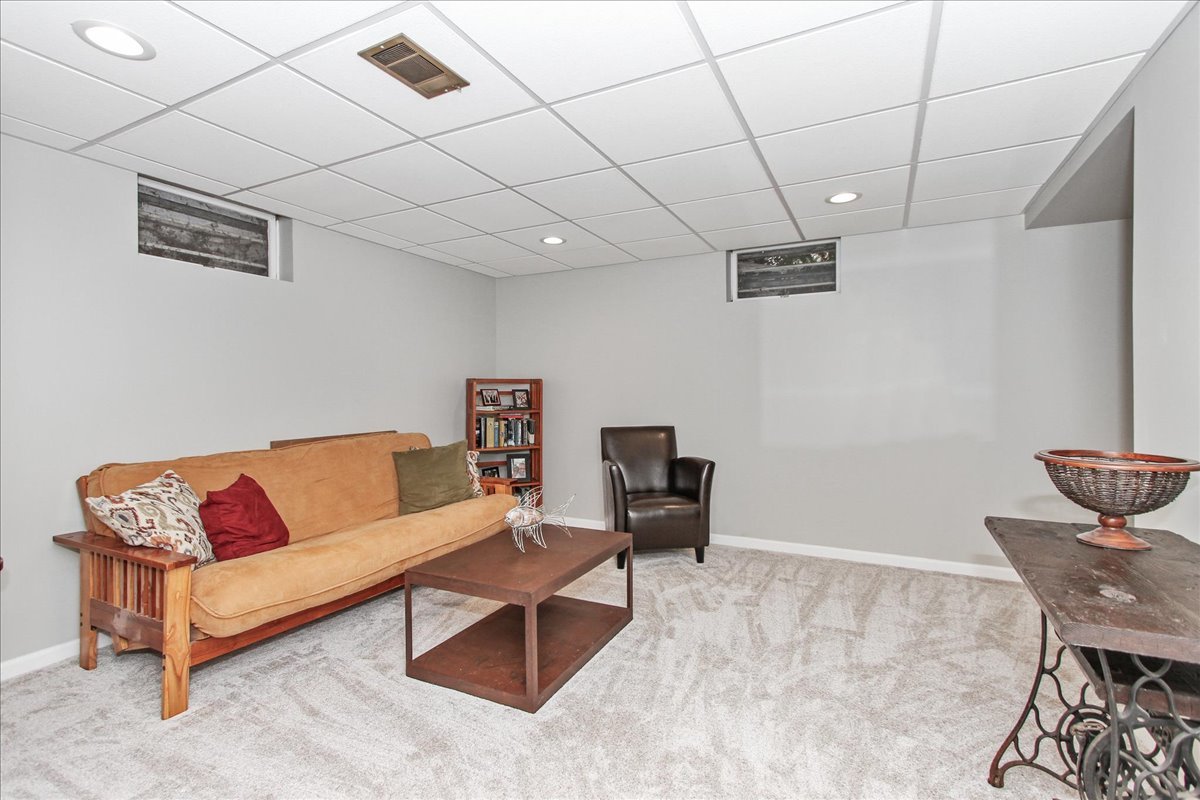 1865 Kevin Avenue Elgin, IL 60123 - Photo 35 of 48 a living room with furniture and a couch