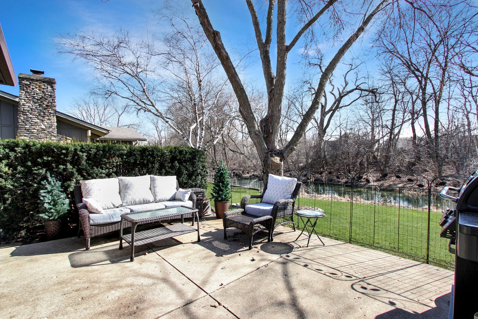 1865 Kevin Avenue Elgin, IL 60123 - Photo 44 of 48 a view of backyard with table and chairs and a barbeque with potted plants and large trees