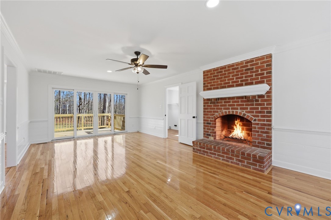 3264 Sherwood Ridge Way Powhatan, VA 23139 - Photo 13 of 40 a view of empty room with wooden floor and fireplace