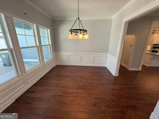 a bathroom with a double vanity sink a toilet and a mirror