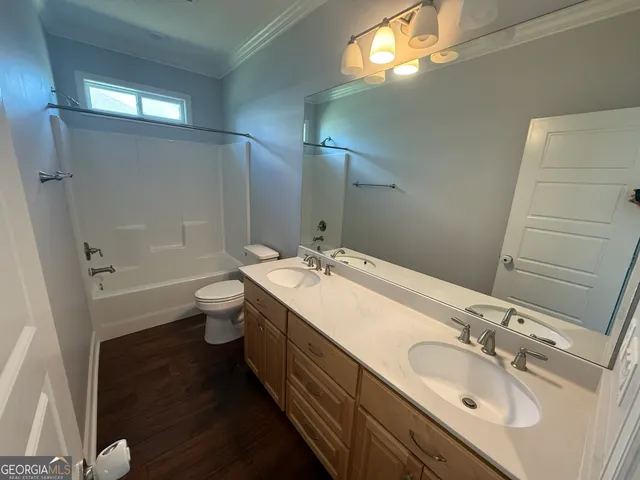 a bathroom with a double vanity sink and mirror