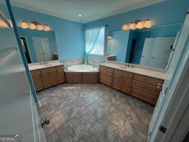a view of a living room with hardwood floor and a ceiling fan