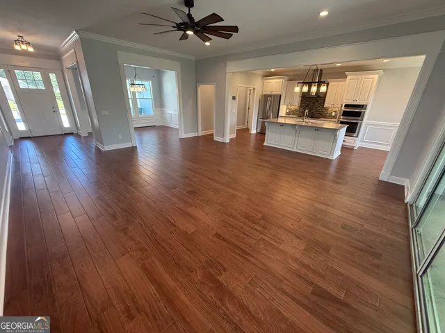 a view of a kitchen from a hallway