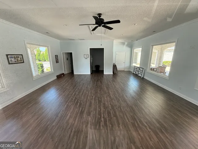a view of a house with a yard and garage