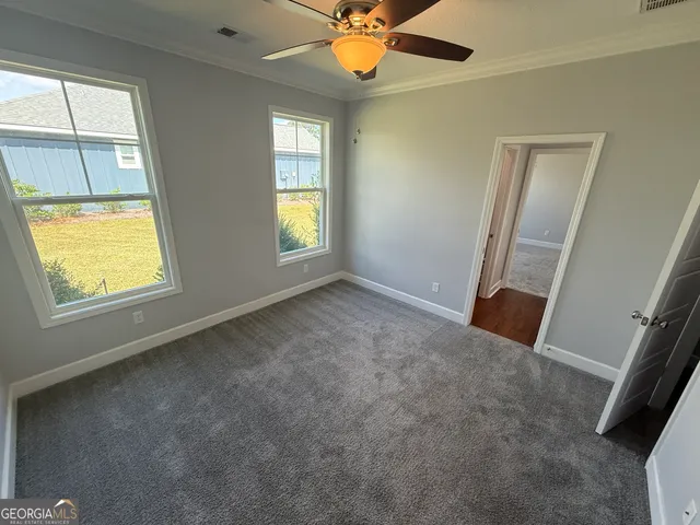 a view of an empty room with a window