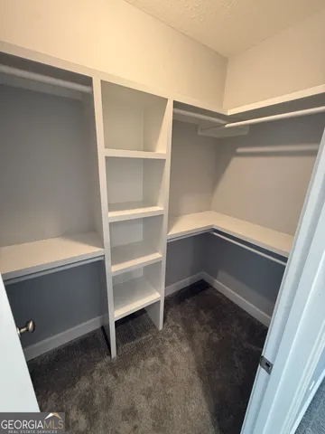 a view of an empty walk in closet
