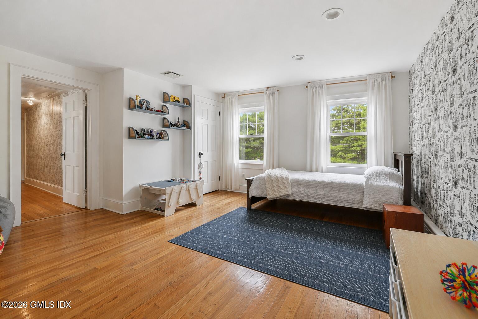 64 Summit Road Riverside, CT 06878 - Photo 21 of 34 a bedroom with a bed and a couch