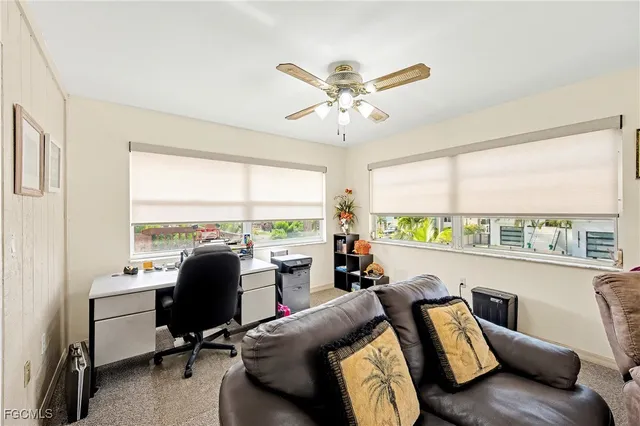 a view of a livingroom with furniture and a window