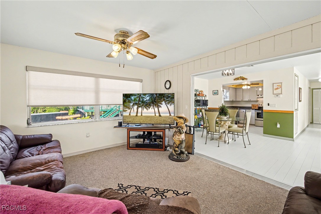 285 Dundee Road Fort Myers Beach, FL 33931 - Photo 12 of 42 a living room with furniture and a large window