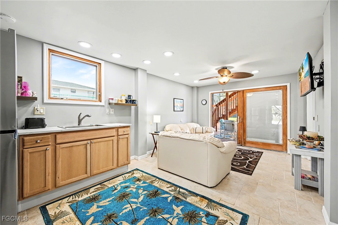 285 Dundee Road Fort Myers Beach, FL 33931 - Photo 21 of 42 a living room with hard wood flooring and furniture