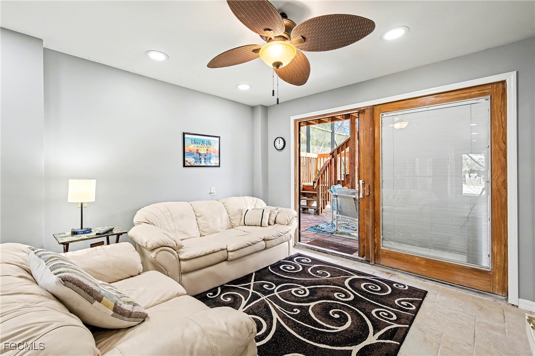 285 Dundee Road Fort Myers Beach, FL 33931 - Photo 25 of 42 a living room with furniture and a large window