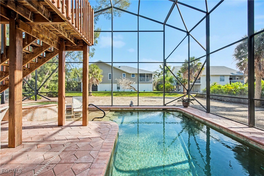 285 Dundee Road Fort Myers Beach, FL 33931 - Photo 40 of 42 a view of a swimming pool with a backyard of house