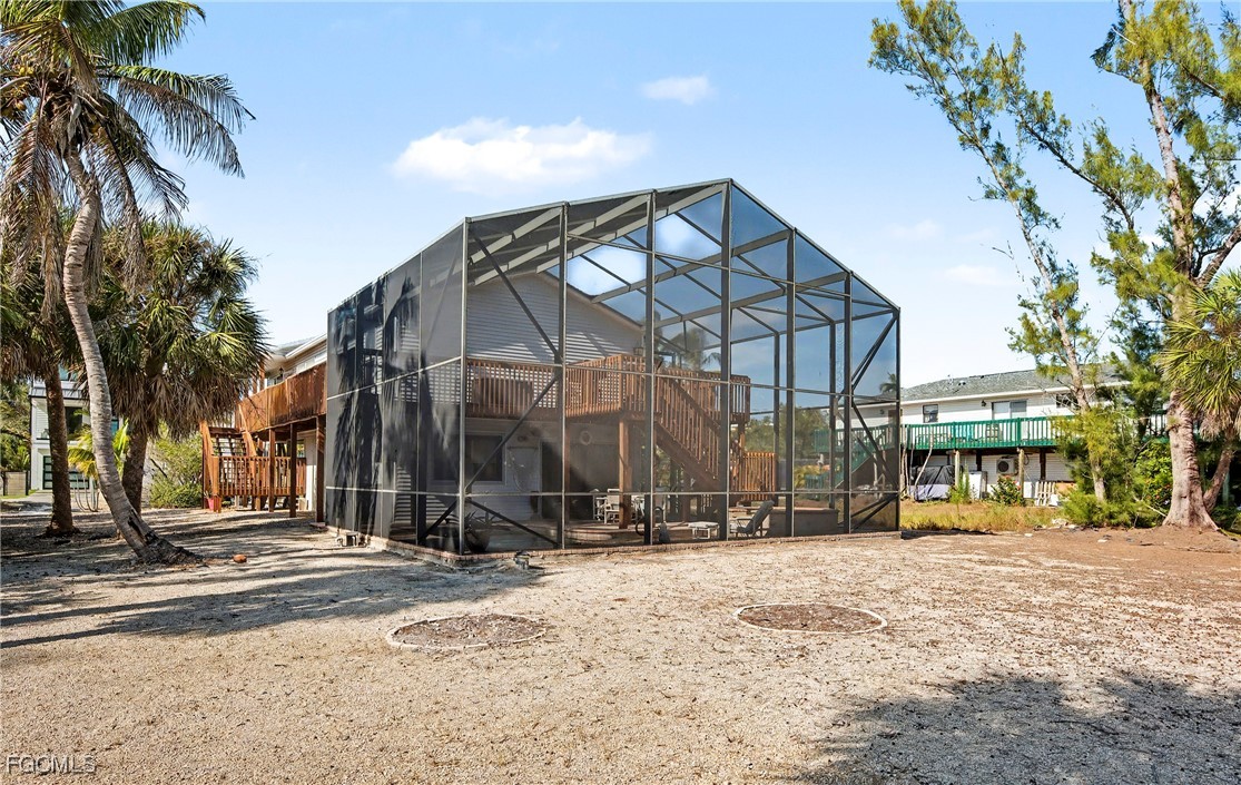 285 Dundee Road Fort Myers Beach, FL 33931 - Photo 4 of 42 a view of a building with a trees