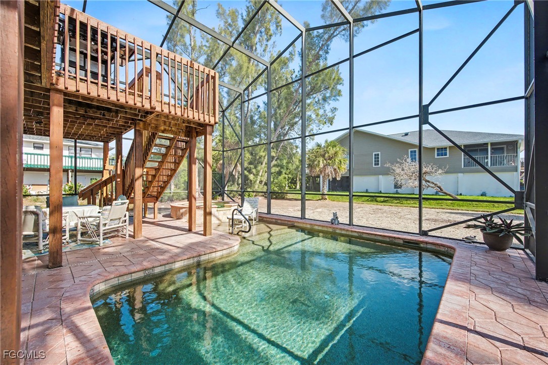 285 Dundee Road Fort Myers Beach, FL 33931 - Photo 6 of 42 a view of a swimming pool with a patio