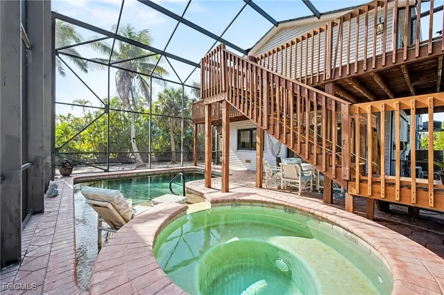 a swimming pool with outdoor seating