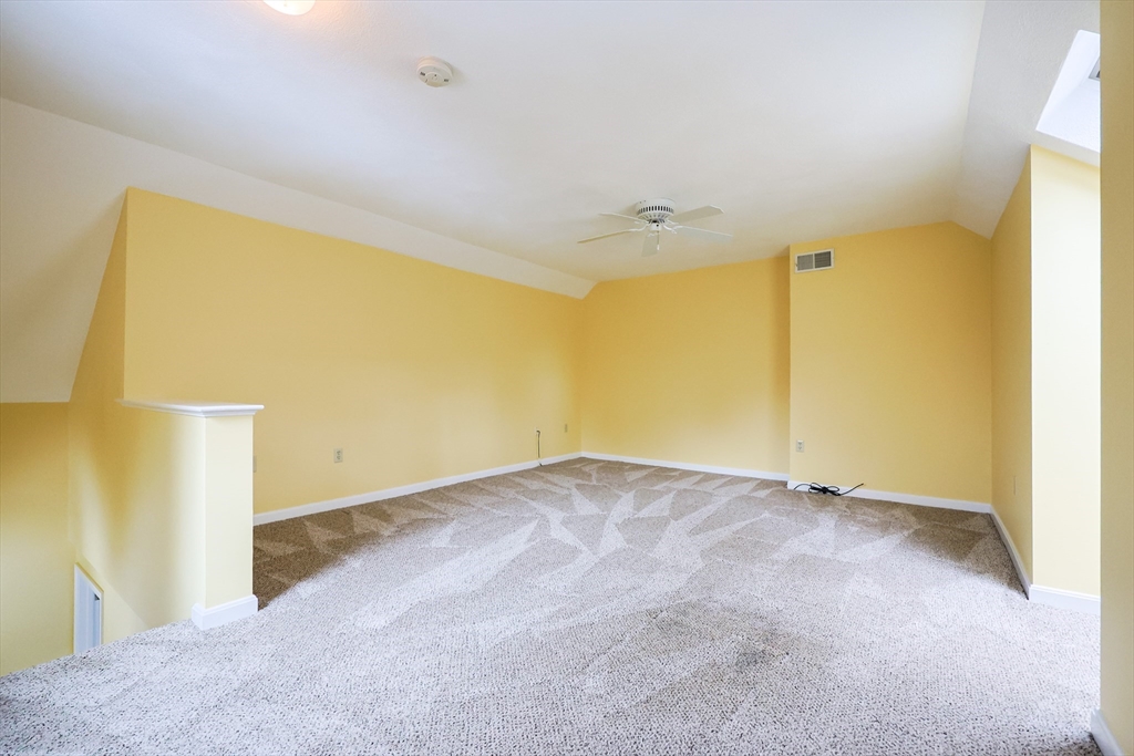22 Deer Path, Unit 6 Maynard, MA 01754 - Photo 12 of 34 a view of an empty room with a window