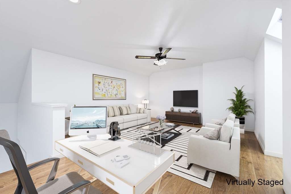 22 Deer Path, Unit 6 Maynard, MA 01754 - Photo 13 of 34 a living room with furniture and a flat screen tv