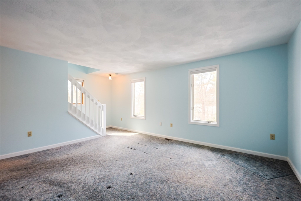 22 Deer Path, Unit 6 Maynard, MA 01754 - Photo 15 of 34 a view of an empty room with a window
