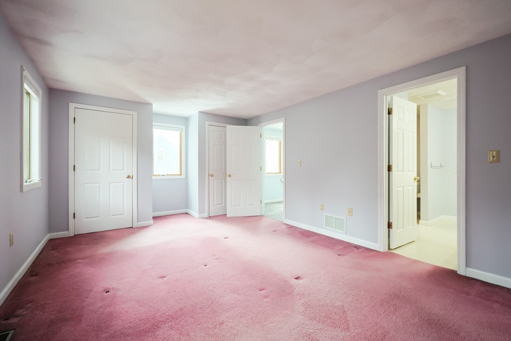 22 Deer Path, Unit 6 Maynard, MA 01754 - Photo 22 of 34 an empty room with closet area
