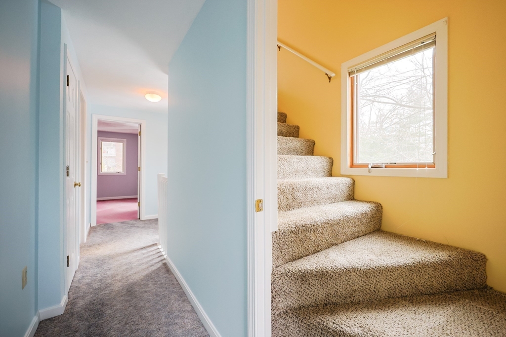 22 Deer Path, Unit 6 Maynard, MA 01754 - Photo 25 of 34 a view of a bedroom from a hallway