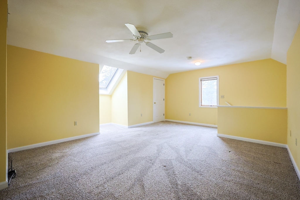 22 Deer Path, Unit 6 Maynard, MA 01754 - Photo 26 of 34 a view of an empty room with a window