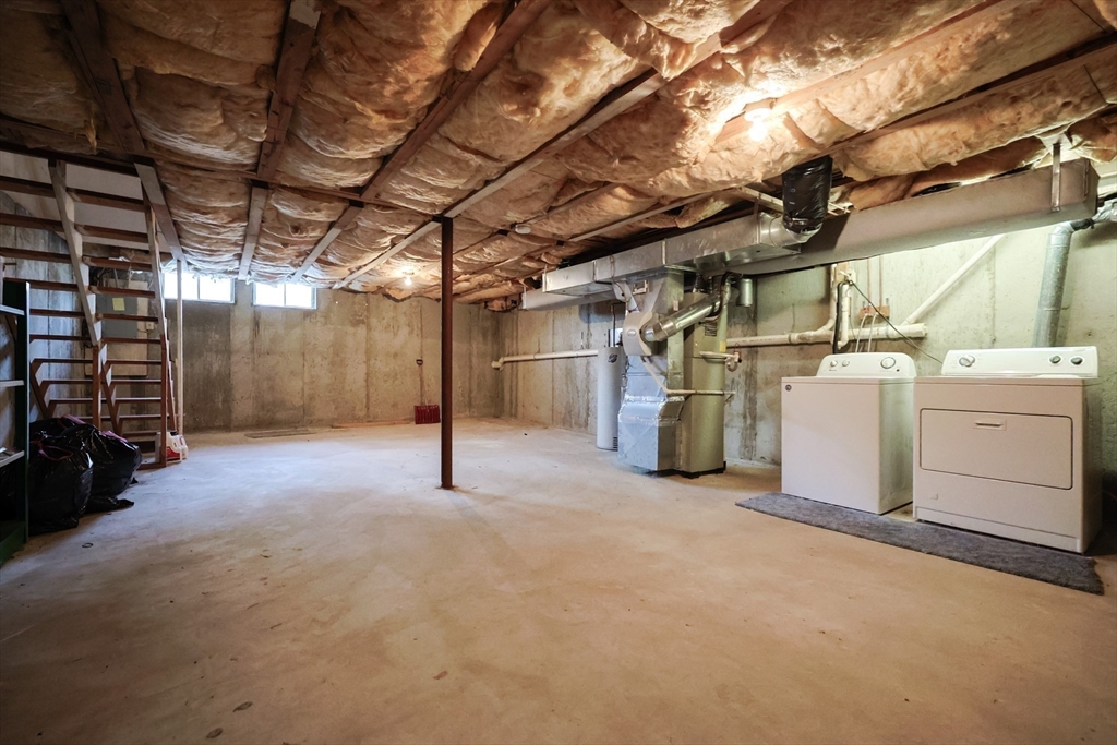 22 Deer Path, Unit 6 Maynard, MA 01754 - Photo 28 of 34 a view of a storage room with racks on the wall